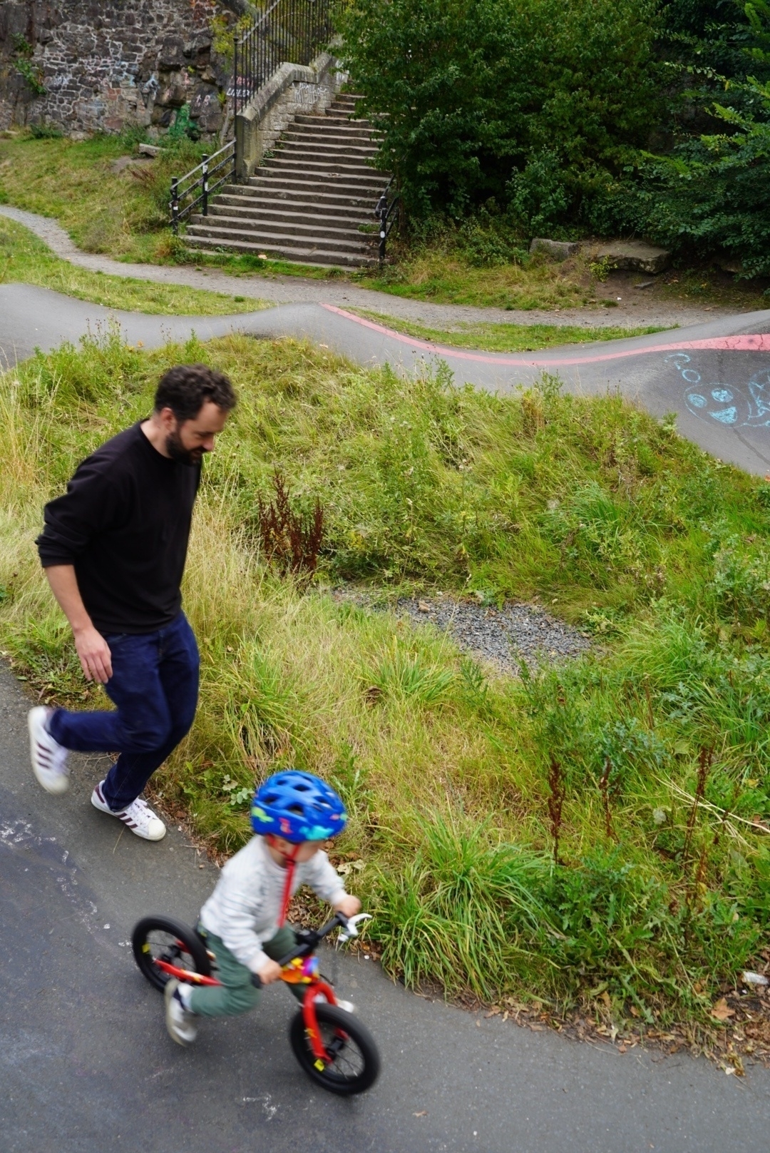 Me running along next to Jack on his wee balance bike